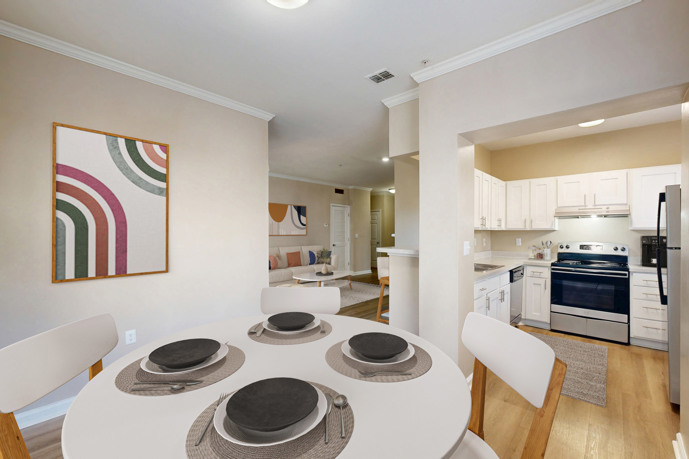 A well-equipped kitchen in Reflections on Sweetwater, featuring modern appliances, ample storage, and contemporary design.